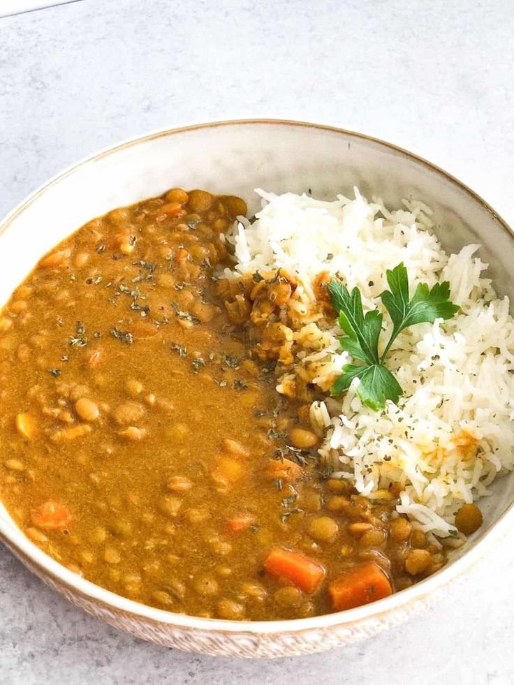 a white bowl filled with beans and rice