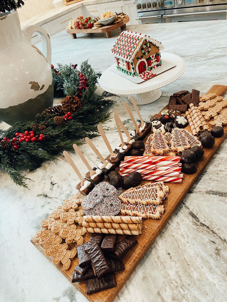 a table topped with lots of cookies and pretzels