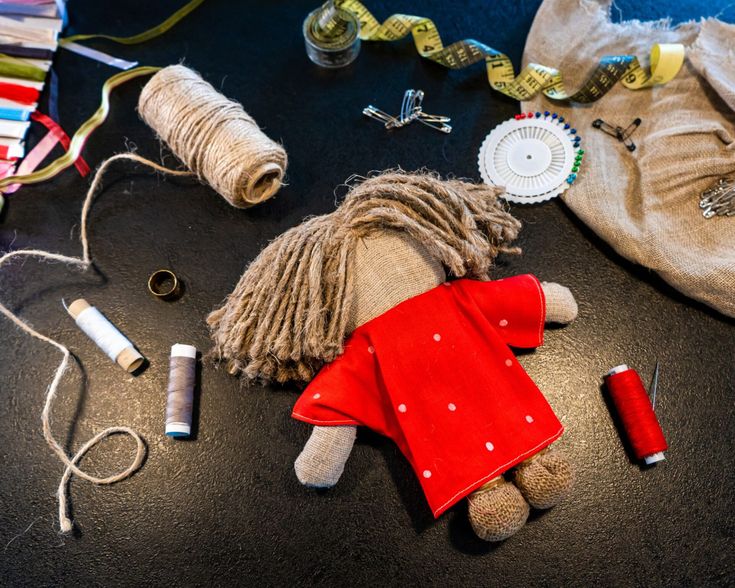 sewing supplies are laid out on the floor