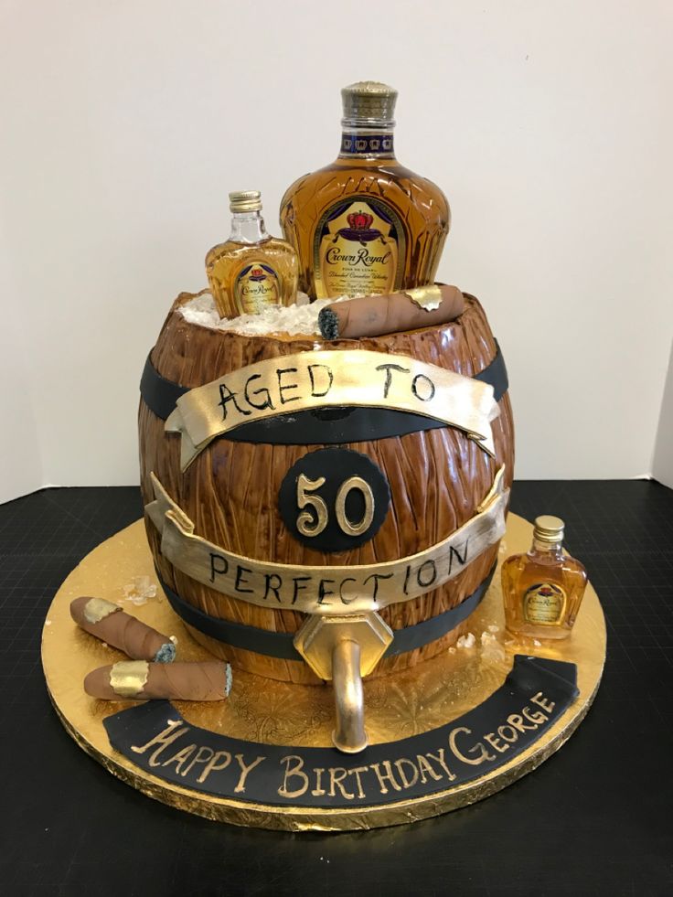 a birthday cake made to look like a barrel with bottles on top and the words aged to 50 perfection