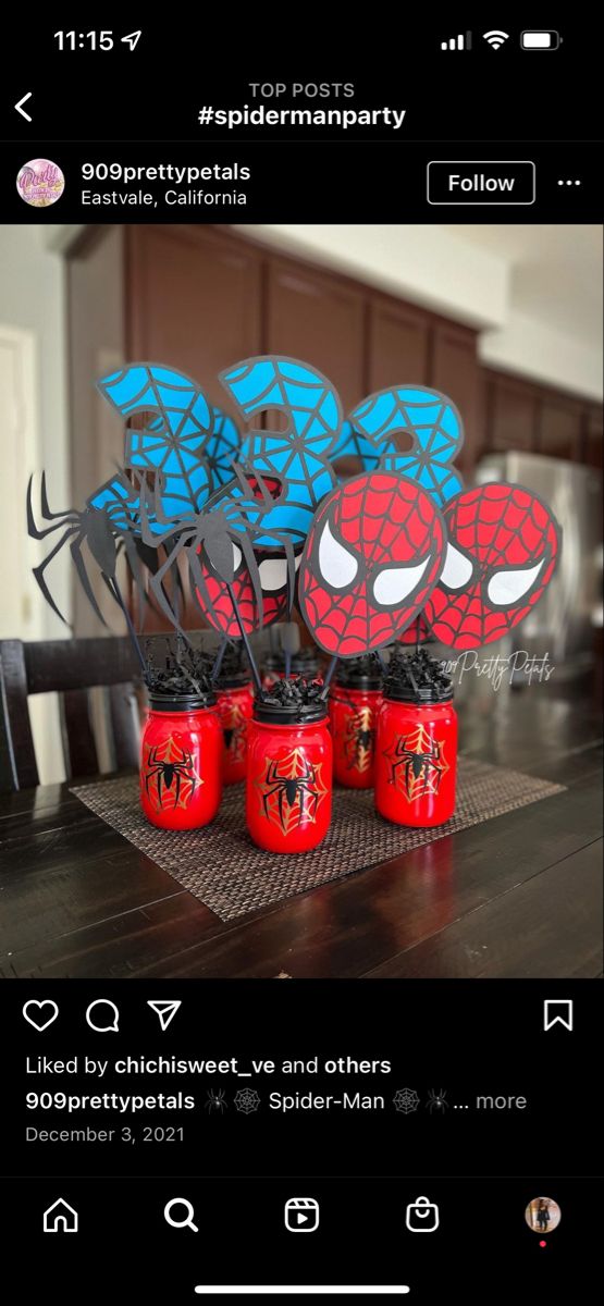 spiderman party favors in red and blue jars