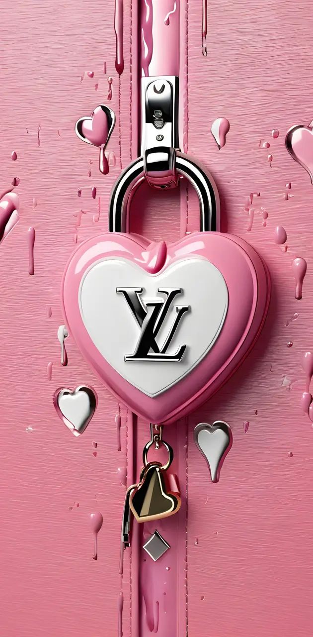 a pink louis vuitton lock with hearts hanging from it's sides and two keys attached to the lock