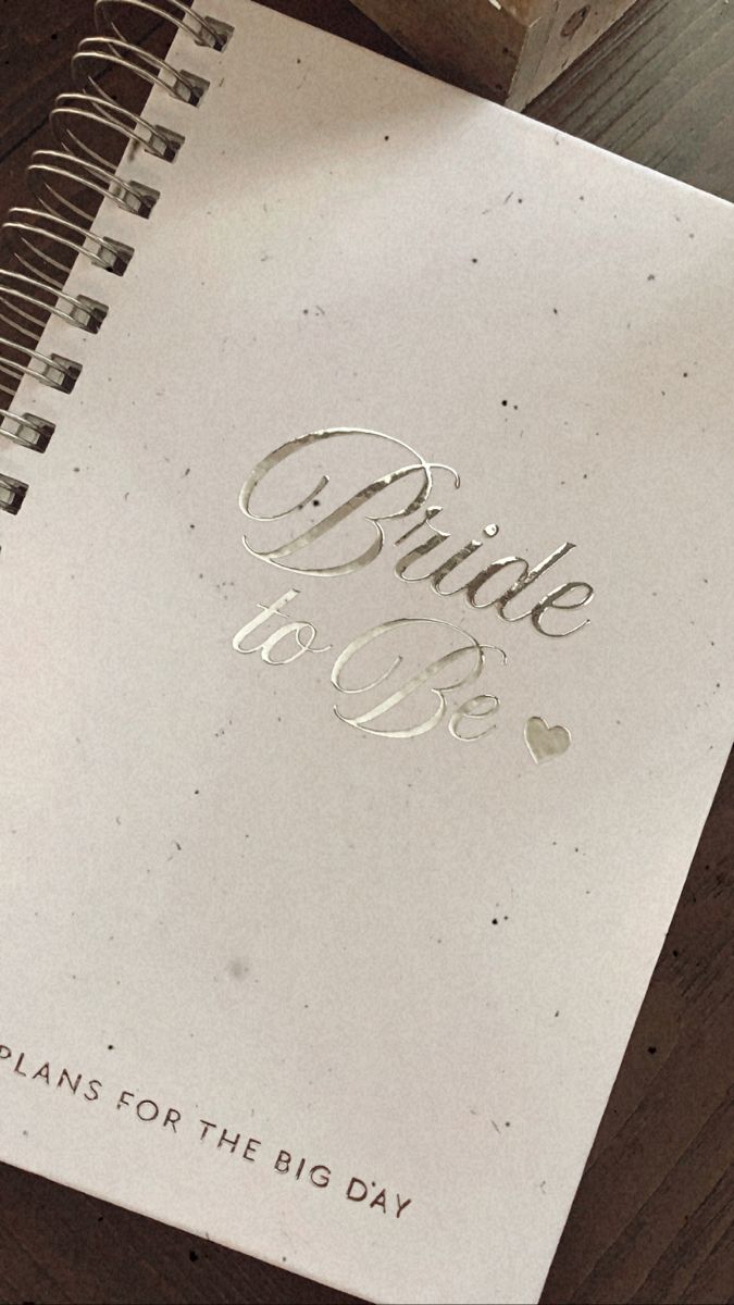 an open spiral notebook with the words bride to be written on it