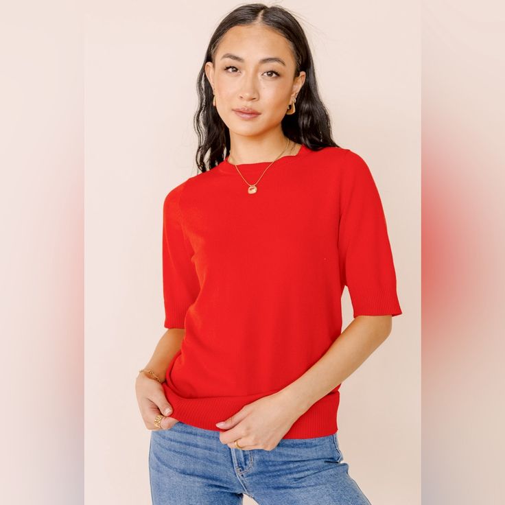 Product Details: * Round Neckline * Short Sleeves * Ribbed Detail On Sleeves, Neck And Bottom * Stretch Knit Material * 83% Viscose, 17% Nylon * Hand Wash Cold, Dry Flat Model Info Height: 5'8'' Wearing Size: Small Small Measurements: Bust: 34", Length: 25.5" Red Stretch Crew Neck Blouse, Red Crew Neck Blouse With Relaxed Fit, Red Stretch Tops For Work, Red Stretch Top For Workwear, Red Relaxed Fit Tops For Work, Red Stretch Top For Work, Relaxed Fit Red Top For Workwear, Casual Red Tops For Work, Chic Red Crew Neck Blouse