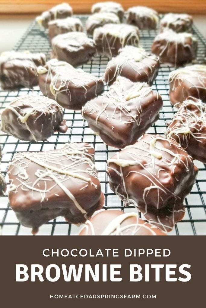 chocolate dipped brownie bites on a cooling rack