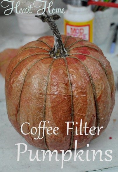 a coffee filter pumpkin sitting on top of a counter