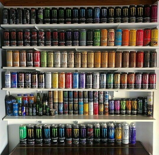 a shelf filled with lots of different colored cans