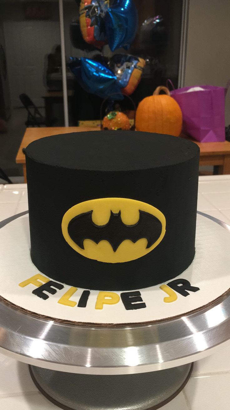 a batman themed birthday cake on top of a table