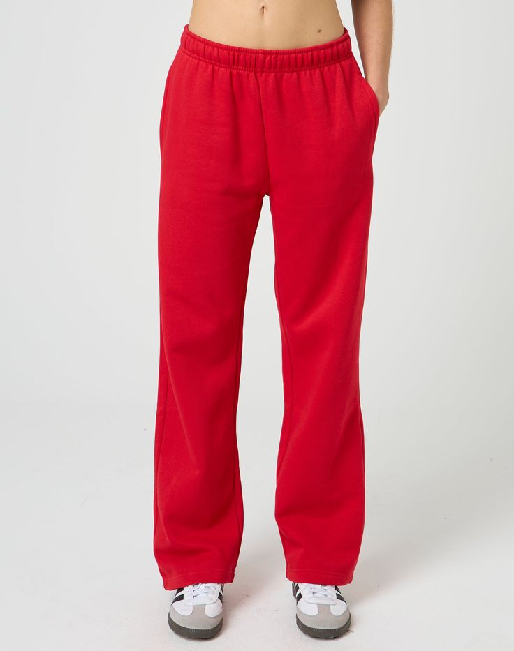 These sweatpants feature a mid rise waist, wide leg fit and an elastic waist. Streetwear Sweats With Elastic Waistband And Wide Leg, Streetwear Wide Leg Sweats With Elastic Waistband, Spring Sweatpants With Straight Hem, Solid Color Straight Hem Sweatpants For Spring, Loosely Fitted Straight Leg Sweatpants With Elastic Cuffs, Relaxed Fit Straight Sweatpants For Fall, Casual Wide Leg Sweats With Elastic Waistband, Sporty Pants With Elastic Cuffs And Straight Leg, Sporty Straight Leg Pants With Elastic Cuffs