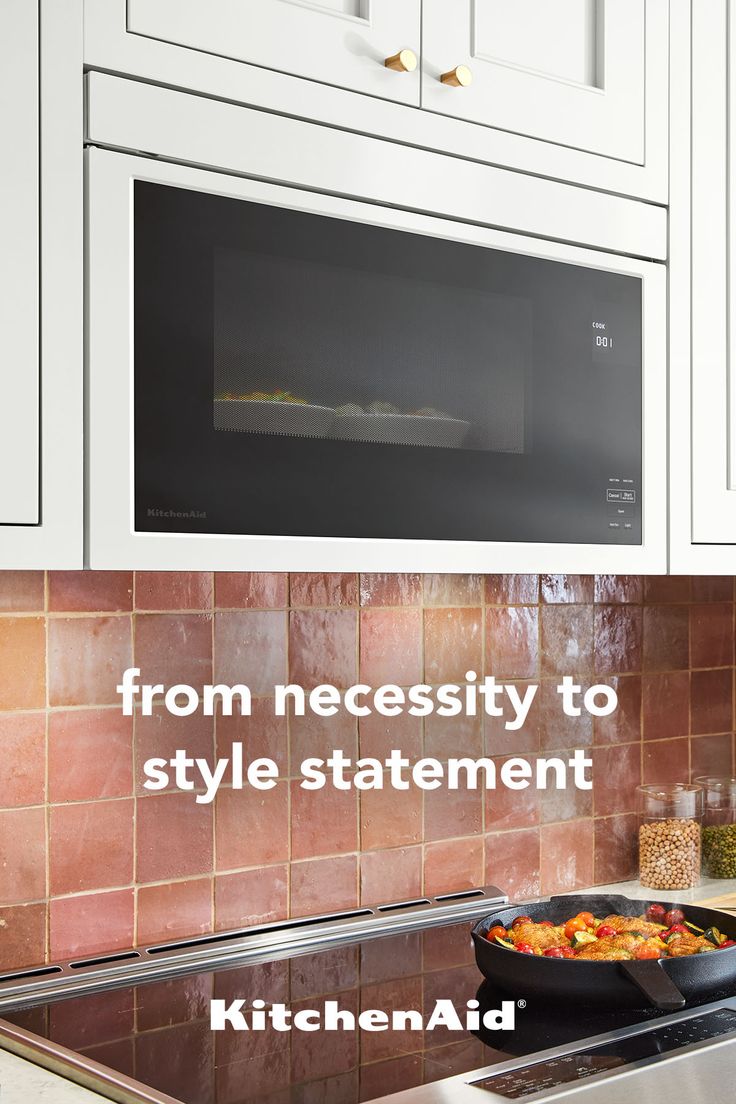 a stove top oven sitting inside of a kitchen next to a microwave above a sink