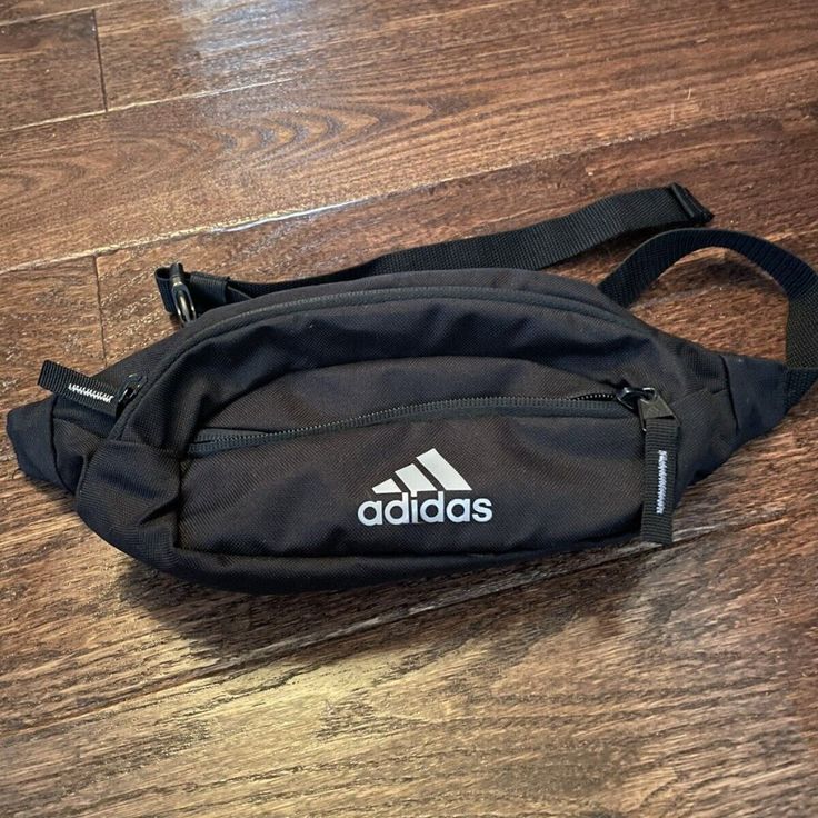 Brand New Never Used Functional Adidas Bags For On-the-go, Black Sporty Bags With Pockets, Everyday Black Pouch Belt Bag, Trendy Adidas Black Bag, Black Pouch Belt Bag For Everyday, Trendy Black Adidas Bag, Adidas Crossbody Bag For Everyday Use, Sporty Black Shoulder Bag With Cell Phone Pocket, Casual Adidas Shoulder Bag For Travel