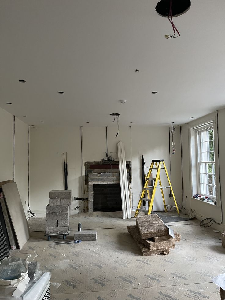 an empty room is being remodeled with construction equipment