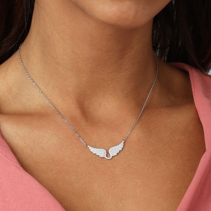 Have you ever wondered what or who lends you wings? This necklace is a special symbol of what gives you hope, inspiration, and power. Whether you're looking for a unique gift or a new addition to your own collection, this necklace is a beautiful choice. Silver Angel Wings Necklace As Gift, Spiritual Winged Sterling Silver Jewelry, Angel Wings Jewelry For Anniversary, Wing-shaped Sterling Silver Necklace, Personalized Wing-shaped Necklaces For Gifts, Spiritual Winged Jewelry For Gift, Personalized Wing-shaped Necklace For Gift, Silver Angel Wings Pendant Necklace, Angel Wings Pendant Jewelry Gift