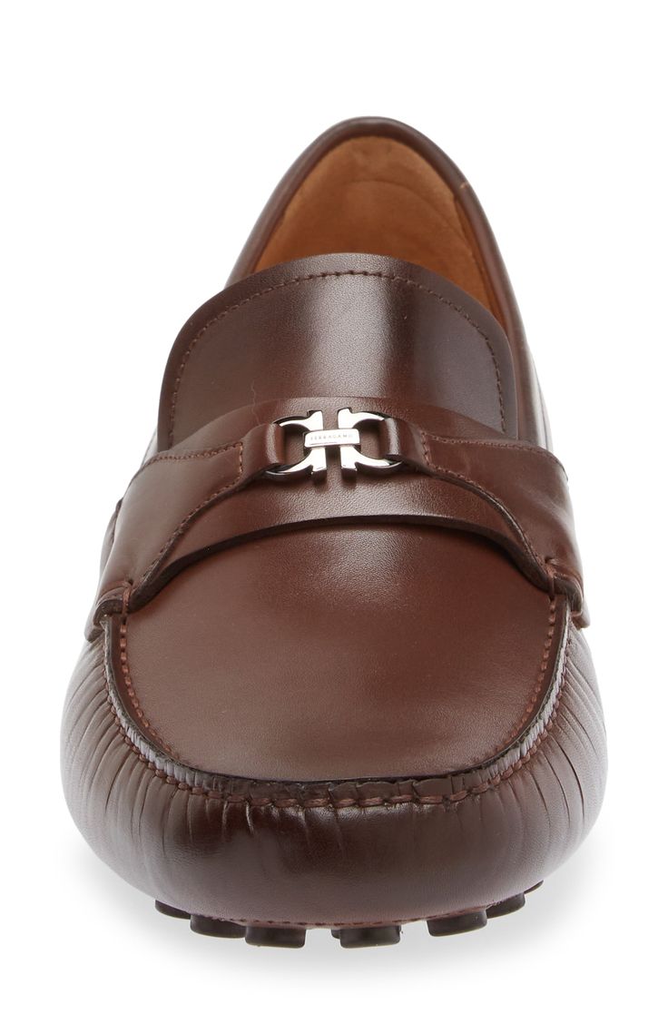 A mini double-Gancio bit tops the strap of this sophisticated take on a driving loafer crafted of calfskin with a hand-sewn sole covered with custom tread. Removable insole Leather upper and lining/leather and rubber sole Made in Italy Men's Designer Shoes Luxury Leather Loafers With Horsebit Detail, Classic Leather Loafers With Horsebit Detail, Classic Leather Shoes With Horsebit Detail, Timeless Leather Loafers With Horsebit Detail, Luxury Moc Toe Moccasins For Driving, Luxury Moccasins With Moc Toe For Driving, Elegant Brown Driving Moccasins, Elegant Brown Driving Loafers, Elegant Driving Loafers With Leather Lining