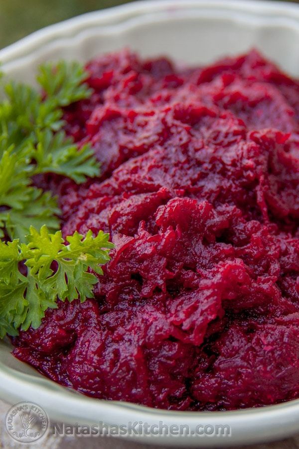 beet sauce in a white bowl with parsley on top