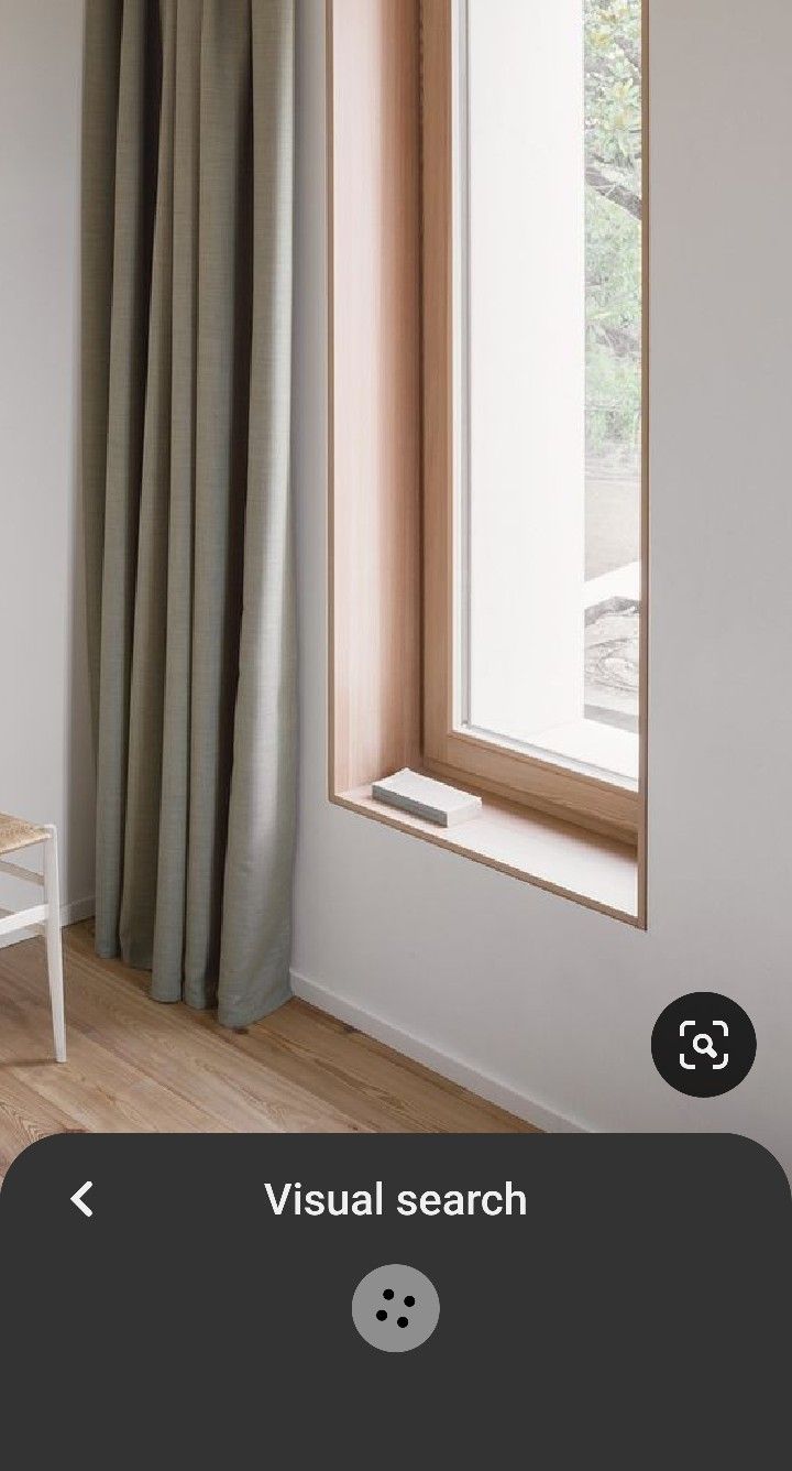 an open window with the words visual search on it next to a small white chair