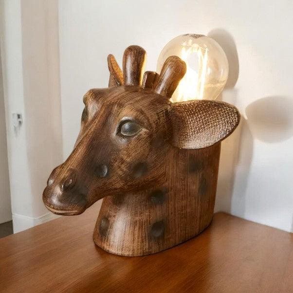 a wooden lamp with a giraffe head on it