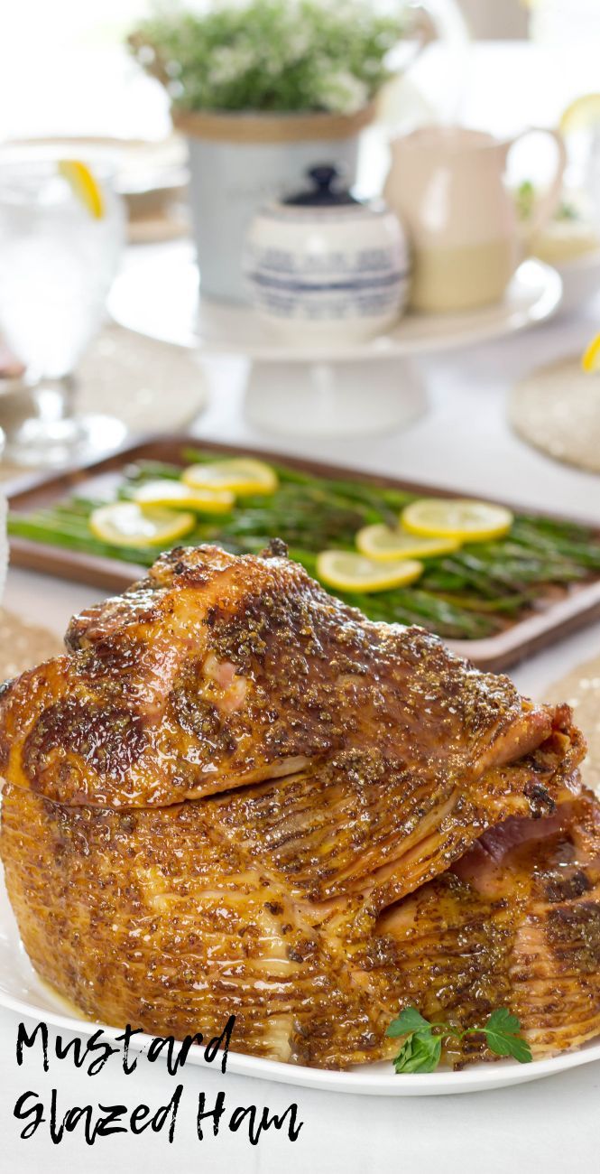 a large cooked ham on a white plate