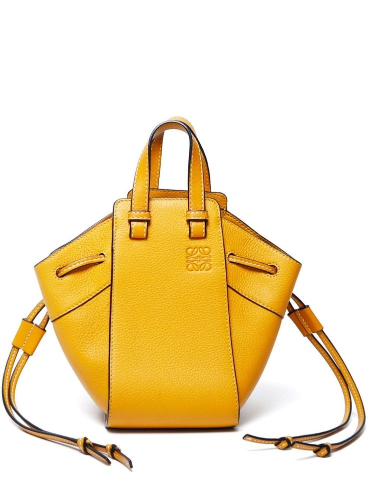 amber yellow calf leather signature debossed Anagram motif two top handles side drawstring fastening main compartment internal slip pocket full lining Condition: GOOD. This previously owned and used item is in good condition with minimal signs of use. This may include fading of material or plating and scratches. Yellow Handbag, Chanel 2, Demi Fine Jewelry, Iconic Bags, Ballet Flat Shoes, Lady Dior, Pump Sandals, Environmental Impact, Favorite Color