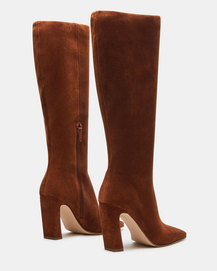 Expertly constructed, the LIZETTE boot is designed with a sleek knee-high silhouette, square toe, and stylish heel. This boot is durable and fashionable, making it the perfect addition to any wardrobe. Elevate your look with these timeless boots. 3.5 inch heel height Size 6 measurements: 14.5 inch shaft circumference, 14 inch shaft height Size 8 measurements: 16 inch shaft circumference, 14.5 inch shaft height Size 10 measurements: 16.75 inch shaft circumference, 15 inch shaft height Textile and Elegant Tall Mid-calf Boots For Fall, Brown Tall Heeled Boots Medium Width, Brown Tall Heeled Boots Medium Fit, Elegant Tall Boots For Fall, Classic Square Toe Knee-high Boots For Fall, Brown Knee-high Heeled Boots, Brown Tall Knee-high Heeled Boots, Tall Platform Boots For Fall, Classic Tall Heeled Boots For Fall