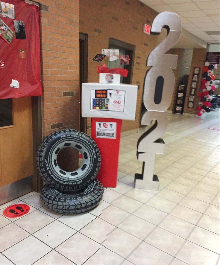 two tires are sitting on the floor in front of a sign that says 2 o'clock