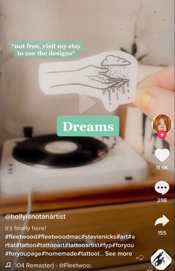 someone is holding up a paper cutout with the words dreams on it, and an image of a person's hand