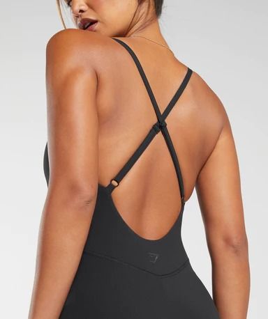 Gymshark Strappy All In One - Black | Gymshark Nylon Activewear With Adjustable Straps For Pilates, Versatile Gym Activewear With Straps, Strappy Activewear With Adjustable Straps For Workout, Fitted Gym Activewear With Straps, Fitted Activewear With Straps For Gym, Versatile Fitted Activewear With Straps, Athleisure Activewear With Strappy Back And Adjustable Straps, Cross Back Activewear With Adjustable Straps For Training, Athleisure Activewear With Adjustable Cross Back Straps