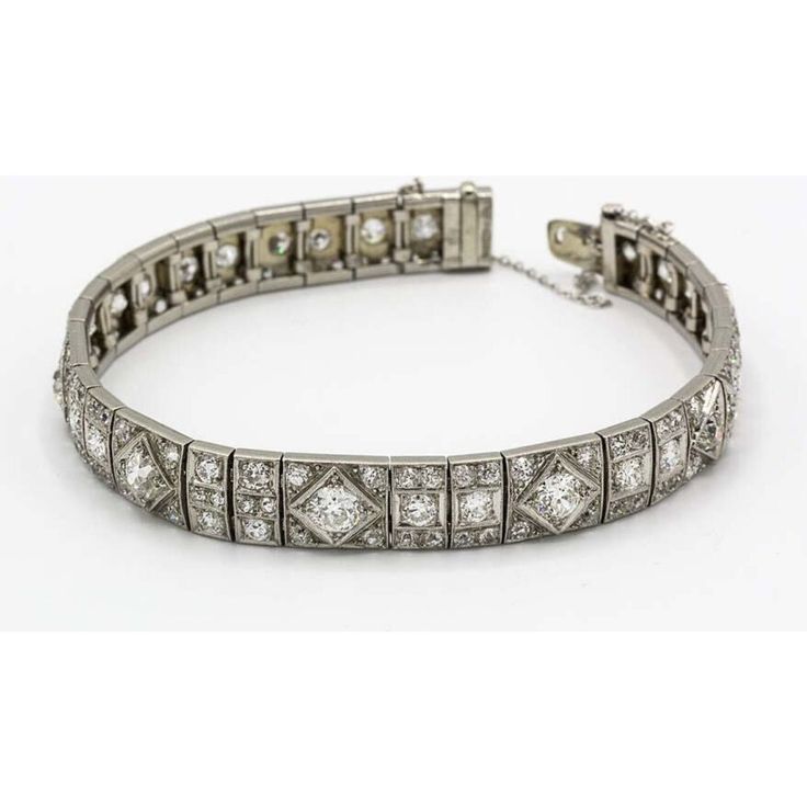 Step into the timeless elegance of the Art Deco era with our stunning Platinum 9cttw Diamond Bracelet. Expertly crafted in platinum, this exquisite bracelet is adorned with a dazzling array of old mine round cut diamonds, totaling approximately 9.00 carats. Each diamond sparkles with unmatched brilliance, adding a touch of opulence to any ensemble.As you slip this bracelet onto your wrist, you'll be transported back to the glamorous 1920s and 1930s, where Art Deco reigned supreme. The sleek and sophisticated design, with its geometric patterns and intricate craftsmanship, captures the essence of that era's architectural and artistic influences.Measuring about 7 inches in length and 0.3 inches in width, this bracelet delicately drapes around your wrist, enhancing your natural beauty with it Diamond Birthstone, Jewelry Accessories Ideas, Accessories Ideas, Tennis Necklace, Platinum Metal, Art Deco Diamond, Art Deco Era, Bracelet Crafts, Diamond Design