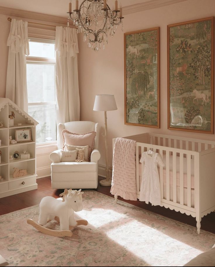 a baby's room with a crib, rocking chair and chandelier