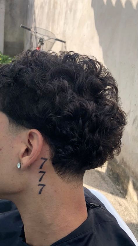 a man with a tattoo on his neck