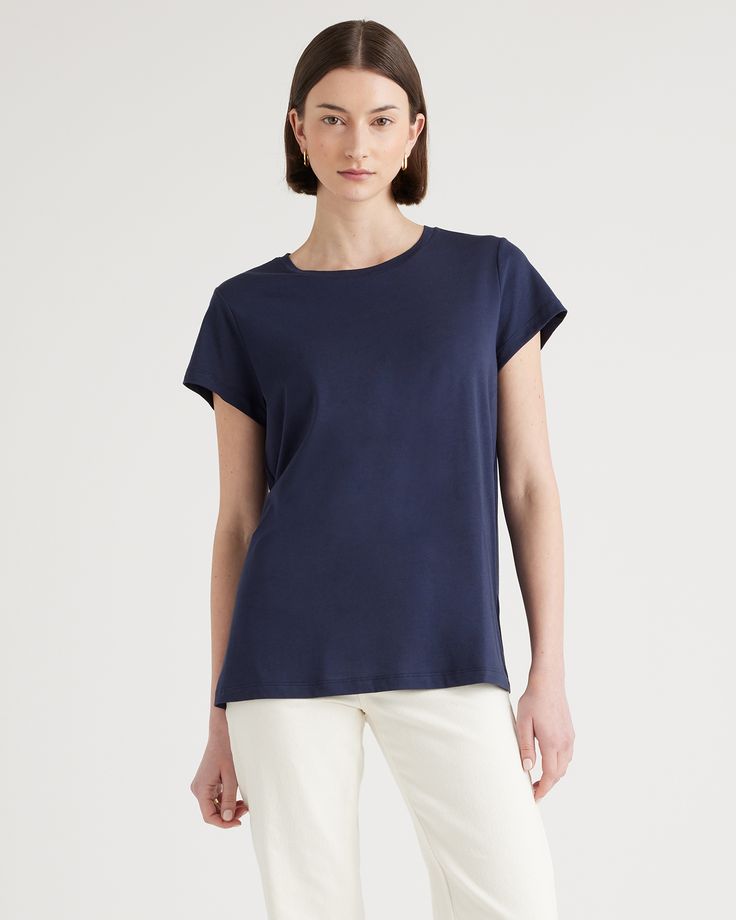 Upgrade your wardrobe basics with our Cotton Modal Crewneck Swing Tee. This super soft and stretchy cotton blend is wrinkle-resistant with a flattering, smooth finish. It's easygoing for everyday wear, and has comfy wearability to pair with any outfit. Relaxed Fit Modal T-shirt, Versatile Cotton T-shirt For Work, Versatile Cotton Crew Neck Top, Solid Color Pima Cotton Tops For Everyday, Solid Pima Cotton Tops For Everyday, Everyday Solid Pima Cotton Tops, Basic Cotton Tops For Workwear, Classic Scoop Neck Top For Workwear, Classic Cotton Tops With Shirttail Hem