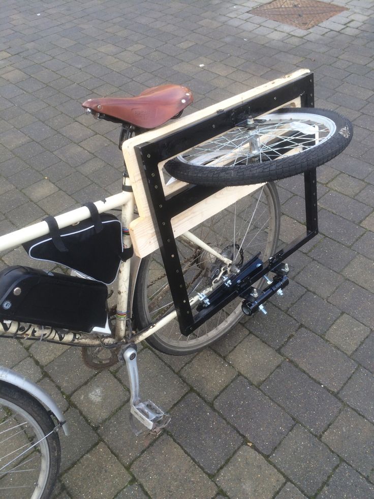 there is a bike with a bicycle rack on it's back tire and seat