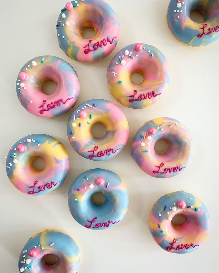 six donuts with different designs and names on them