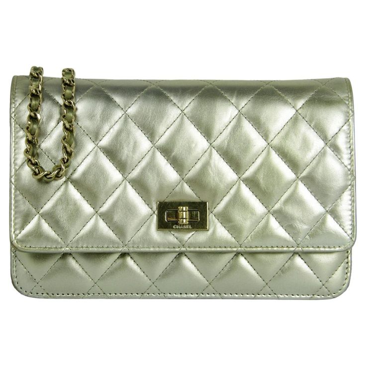 Chanel Metallic Gold Leather Quilted Reissue Wallet On Chain WOC Crossbody Bag. Chain can be tucked inside bag to also be worn as a clutch. Interior features green gold color detail.  Made In: Italy Year of Production: 2016-2017 Color: Gold Hardware: Goldtone Materials: Calfskin leather Lining: Leather and grosgrain Closure/Opening: Flap top with twistlock closure Exterior Pockets: Back patch pocket Interior Pockets:  Zipper under flap, slit at pocket, zipper pocket, six credit card slots Exterior Condition: Very good/excellent. Light wear to corners- see photos Interior Condition: Excellent Includes: Chanel box, dustbag, authenticity card Measurements: 7.5"L x 5H x 1.5"D Strap Drop: 24" Chanel Box, Inside Bag, Wallet On Chain, Bag Chain, Gold Leather, Metallic Leather, Green Gold, Metallic Gold, Fashion Handbags