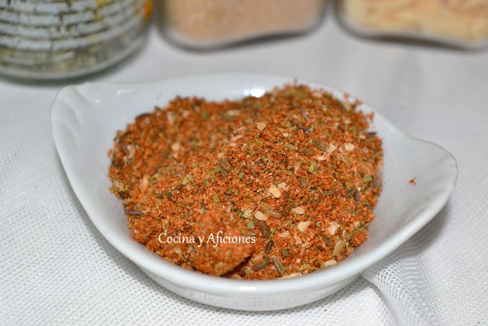 a white bowl filled with spices on top of a table