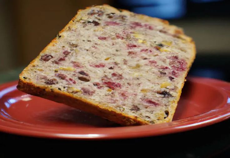 a piece of bread on a red plate