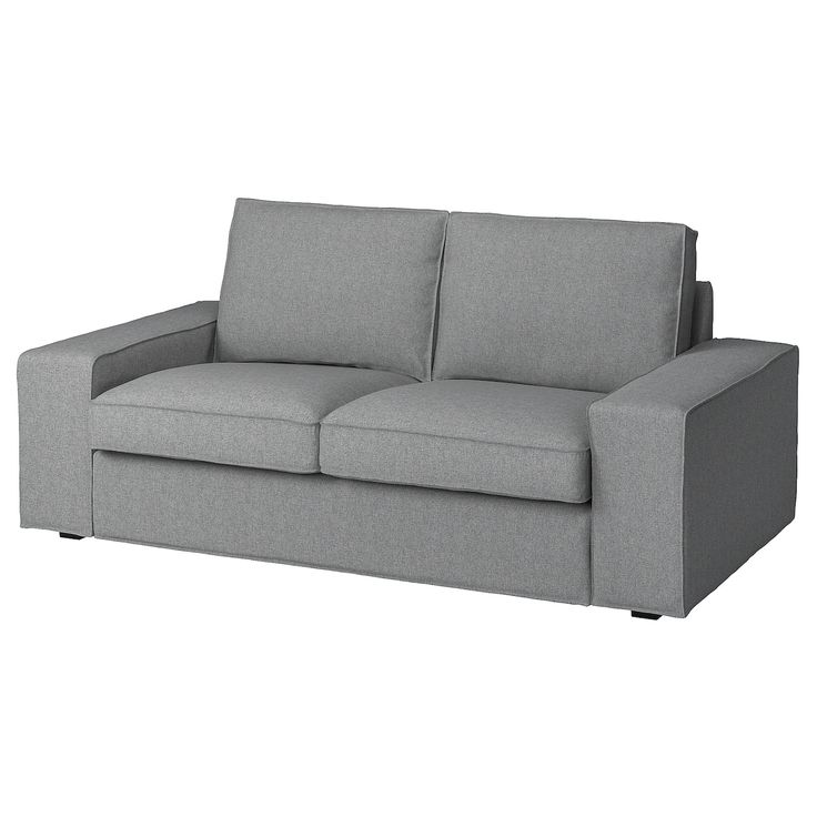 a gray couch sitting on top of a white floor