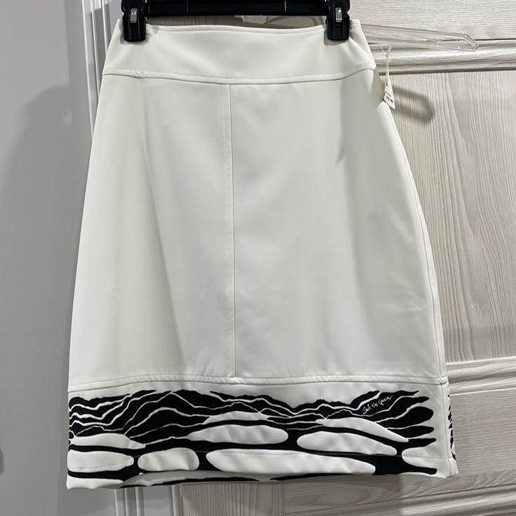 White Skirt White Relaxed Fit Midi Pencil Skirt, White Flowy Lined Skort, White Relaxed Mini Skirt With Lining, Casual White Pencil Skirt, White Lined Midi Pencil Skirt, White Pencil Skirt Skort For Summer, Chic White Relaxed Pencil Skirt, White Midi Pencil Skirt For Spring, White Pencil Mini Skirt For Day Out