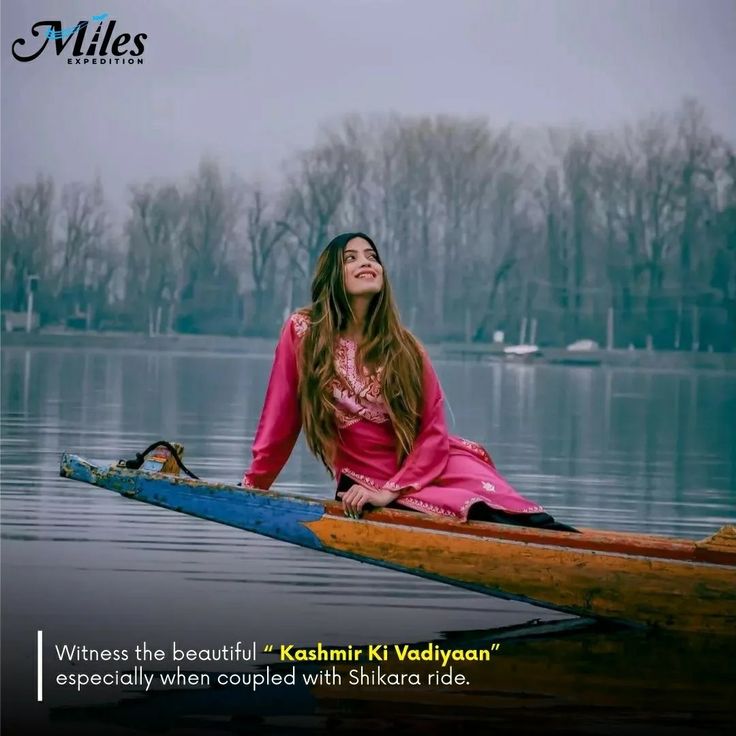 a woman sitting on top of a wooden boat in the middle of a body of water