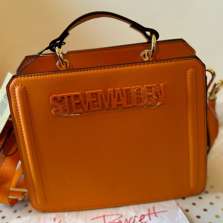 Viral Tiktok Bag 2 Orange 2 Black 1 Baby Blue Price Listed Is Per Bag When You Check Out List What Color You Want Designer Orange Shoulder Bag For Shopping, Designer Orange Office Bags, Orange Shoulder Bag With Branded Hardware For Everyday, Orange Bags With Detachable Strap, Orange Shoulder Bag With Detachable Strap, Orange Crossbody Satchel, Orange Satchel With Gold-tone Hardware For Shopping, Rectangular Orange Satchel, Orange Rectangular Bags With Branded Hardware