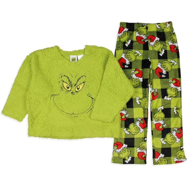 a child's pajama set in green and black with an angry grin face on it