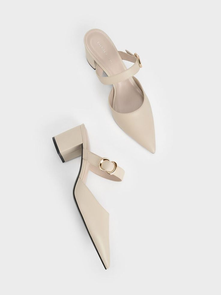 Perk up any charming outfit with these elegant mules. Made in a flattering chalk-white shade that matches almost every aesthetic, these pointed-toe pumps will easily become one of your best purchases this season. The metallic accent element, as well as the sturdy 6cm block heels ensure style without compromising on walkability. Plus, we are loving the sleek pointy toe. For a confident look, style them with a bodycon dress and a sculptural bag. Pointed Toe Heels Outfit, Vivienne Westwood Shoes, Every Aesthetic, Pointed Shoes, Feminine Shoes, Shoes Heels Classy, Steel Accessories, Elegant Sandals, Classy Shoes