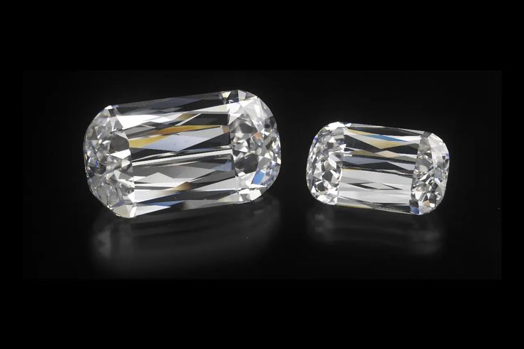 two diamond cut diamonds sitting side by side