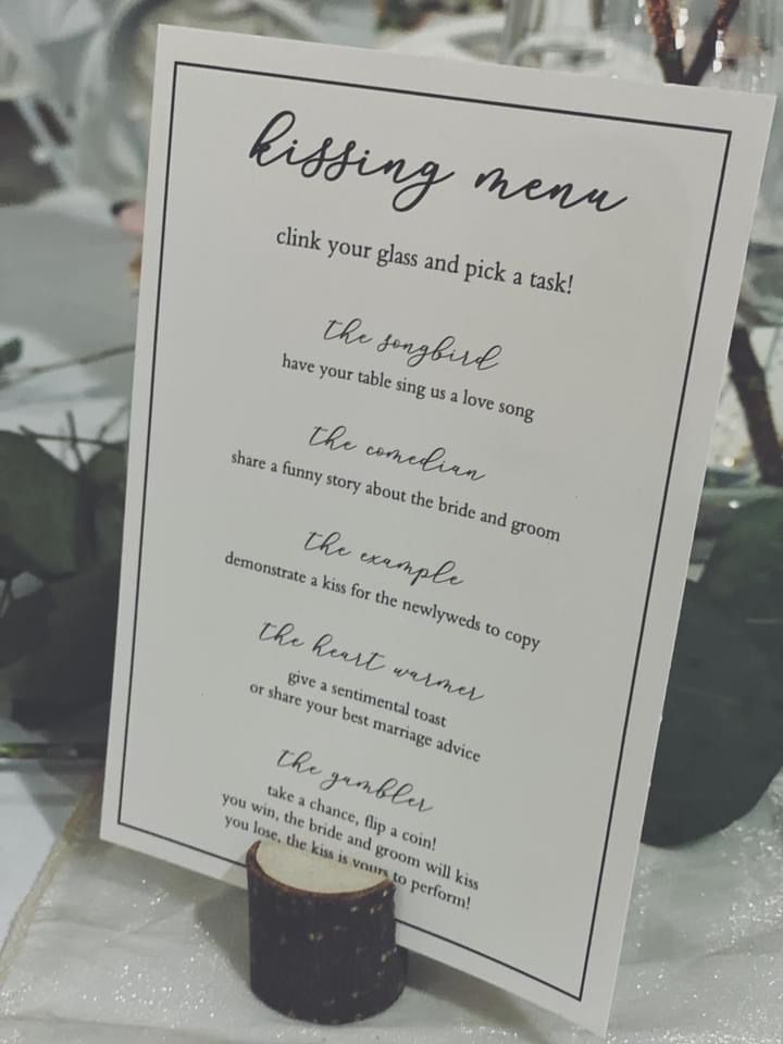 a wedding menu is displayed on a table