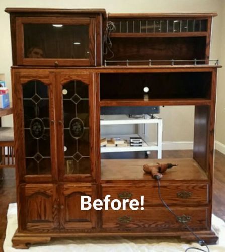 an old entertainment center has been refinished with new glass doors and wood trim