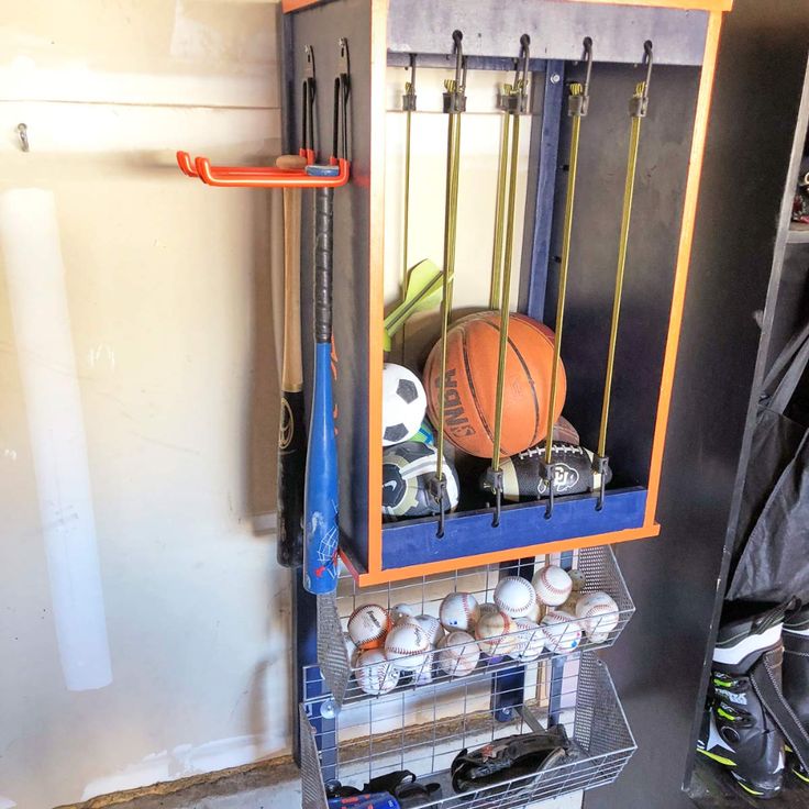 a rack with baseballs and other sports equipment