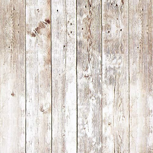 an old wooden wall with peeling paint and chipped wood planks, as background or texture