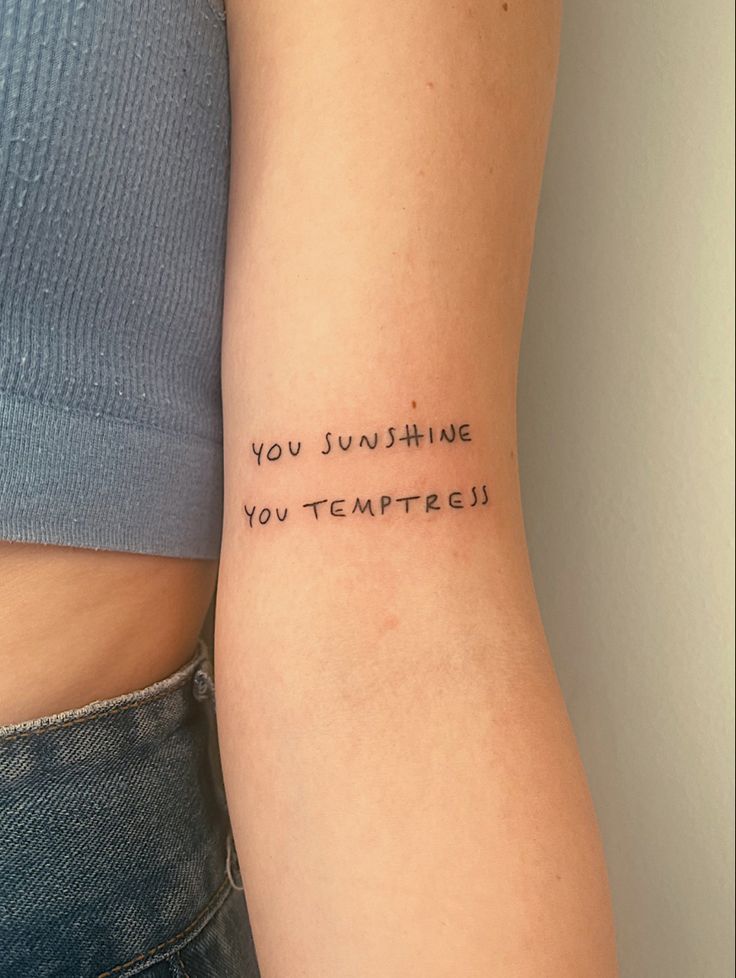 a woman's arm with the words you sunshine, you tempestpete written on it