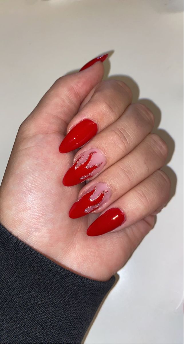 Red flame design nails with glitter accents Fire Red Nails Design, Red Nails Flame Design, Red Nails Fire Design, Red And Orange Flame Nails, Red Concert Nails, Red Vegas Nails, Red Flame Nail Designs, Fun Red Nail Designs, Flame Almond Nails