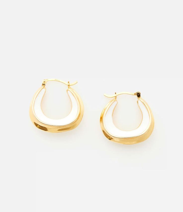 The carved shape of our Enamel Sculpture earrings is inspired by our favorite sculptures. Cast from polished 18-karat gold, they're traced with white enamel or Emerald Green enamel to make them pop. Show them off with pushed-back hair.1" drop, 1” wide Modern White Hoop Jewelry, Luxury White Earrings For Everyday, White Tarnish Resistant Hoop Earrings As Gift, White Enamel Hoop Earrings For Gifts, White Tarnish Resistant Drop Earrings, White Tarnish-resistant Drop Earrings, Luxury White Enamel Earrings, White Polished Hoop Jewelry, White Hoop Jewelry With Polished Finish